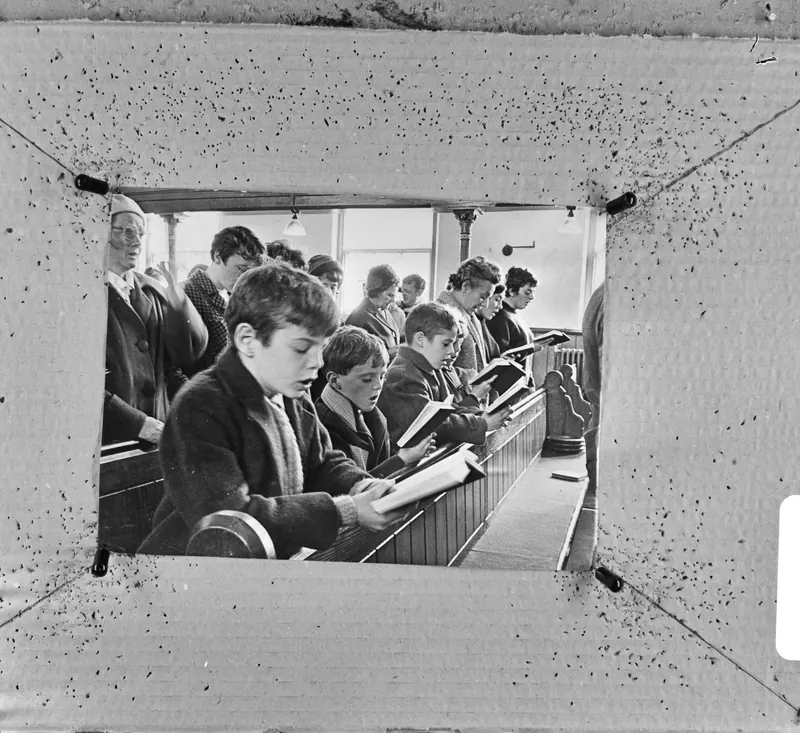 Children and adults singing in Zion Baptist Chapel, Aberfan