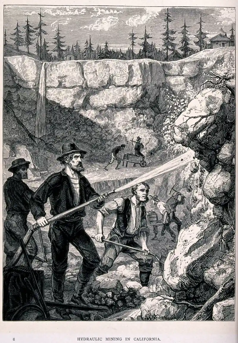 Hydraulic gold mining, with water jets cutting a hillside