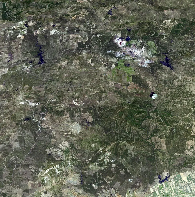 Satellite image of the Rio Tinto mines in Spain with red and ochre waters