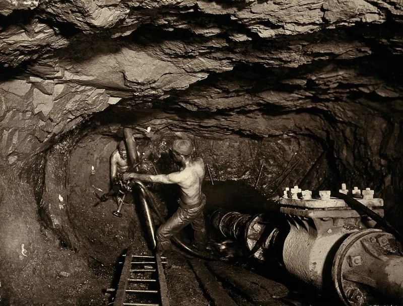 Two miners in a shaft at Tincroft tin mine near Camborne, Cornwall