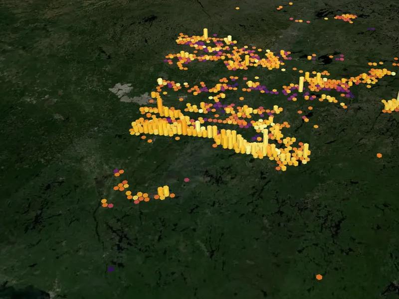 Gold drill-hole columns over the Abitibi on a satellite map of Québec