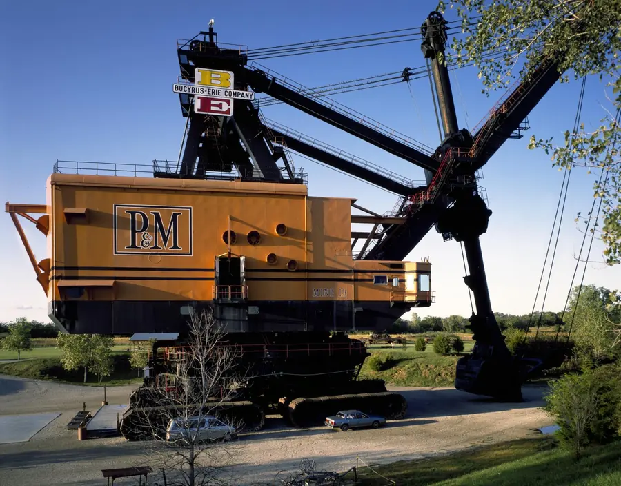 Big Brutus, a giant stripping shovel, towering over the cars and trees around it
