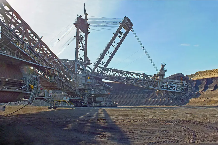 Bagger 288 seen from below, its steel boom and counterweight towering over the mine floor
