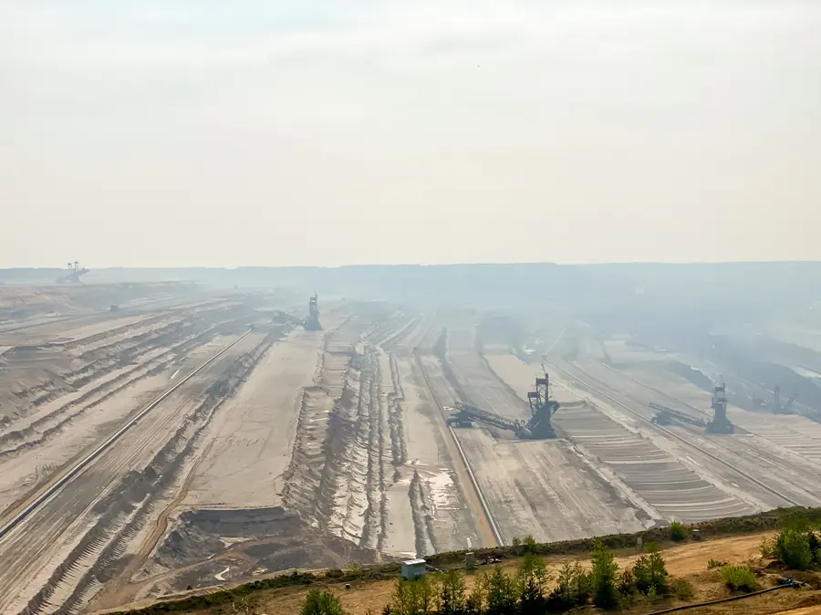 Aerial view across the terraced Hambach pit, with excavators tiny on the benches