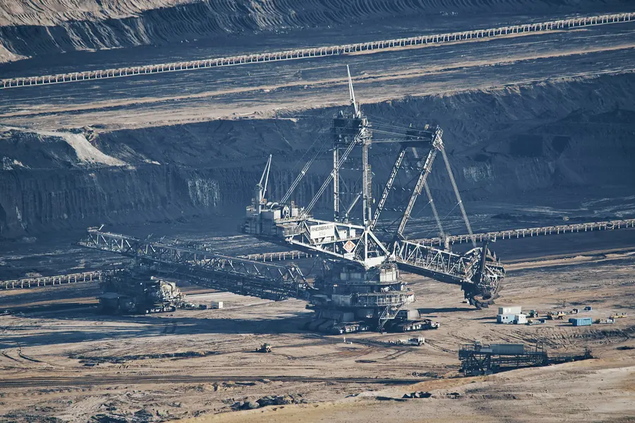 A bucket wheel excavator on a terrace of the Hambach pit, with conveyor belts running along the benches