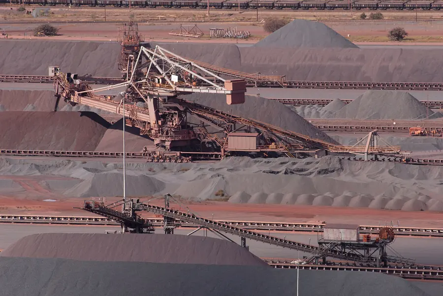 Bucket wheel stacker-reclaimers working long stockpiles of red iron ore