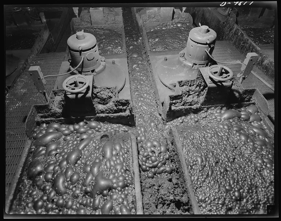 Two flotation machines seen from above, their tanks brimming with large bubbles