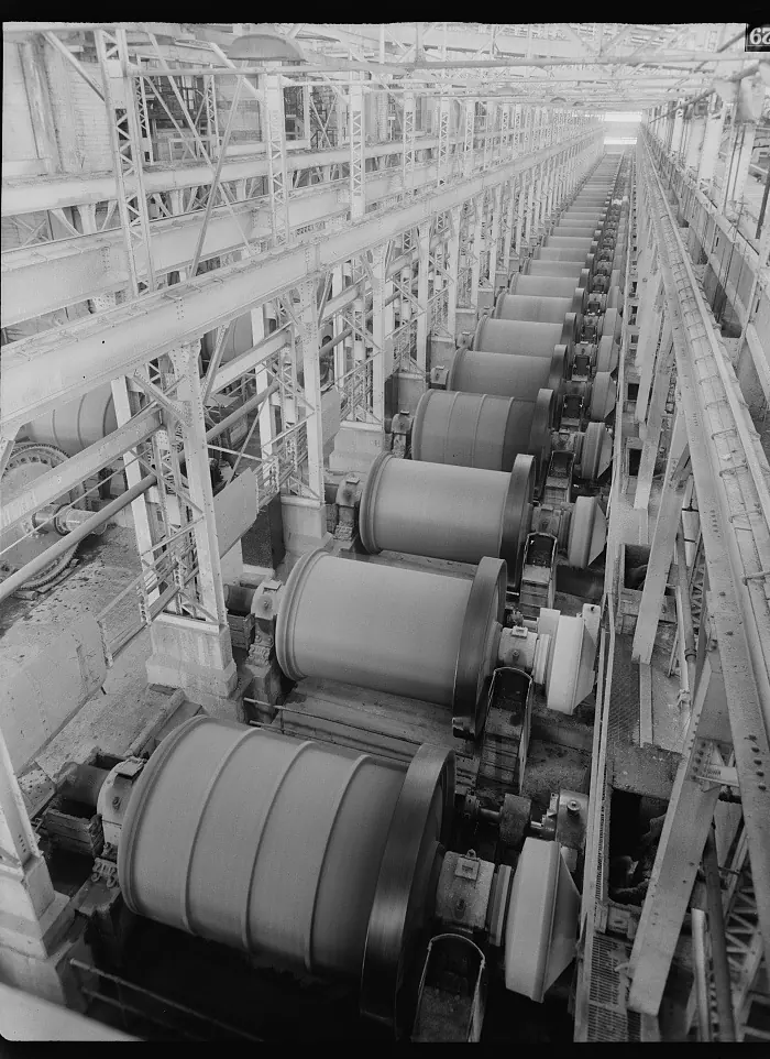 A long row of ball mills down the length of a concentrator hall
