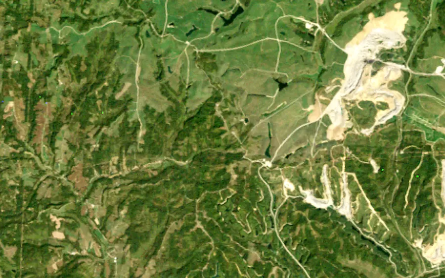 Hills around Cumberland, Ohio, from space: pale strip-mine cuts in 1987, and the same ground green and replanted in 2025